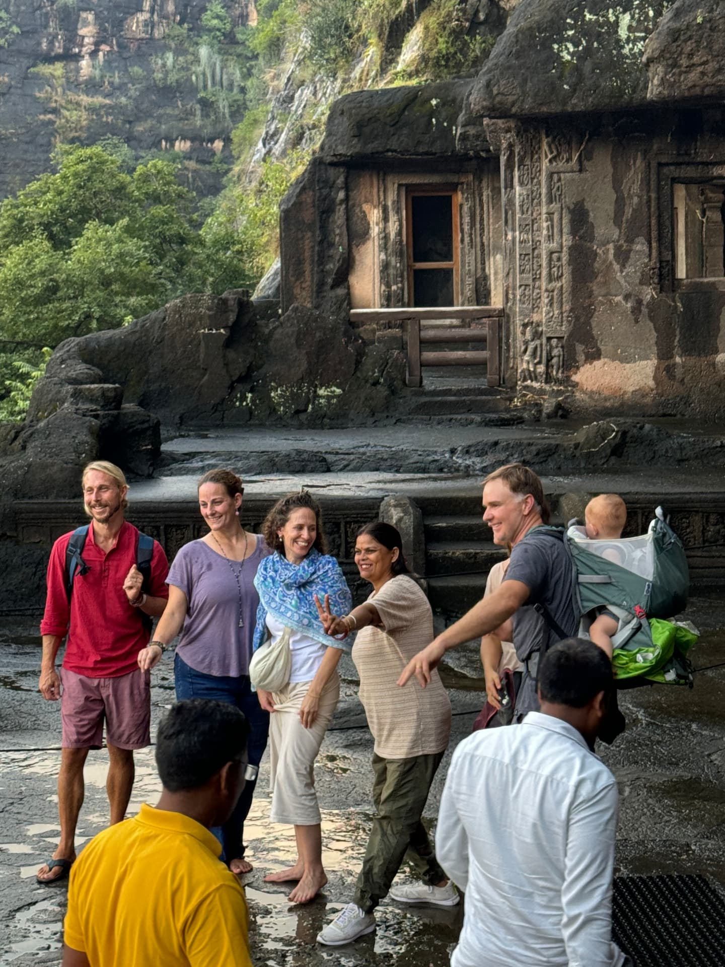 The group outside a rock-cut cave temple