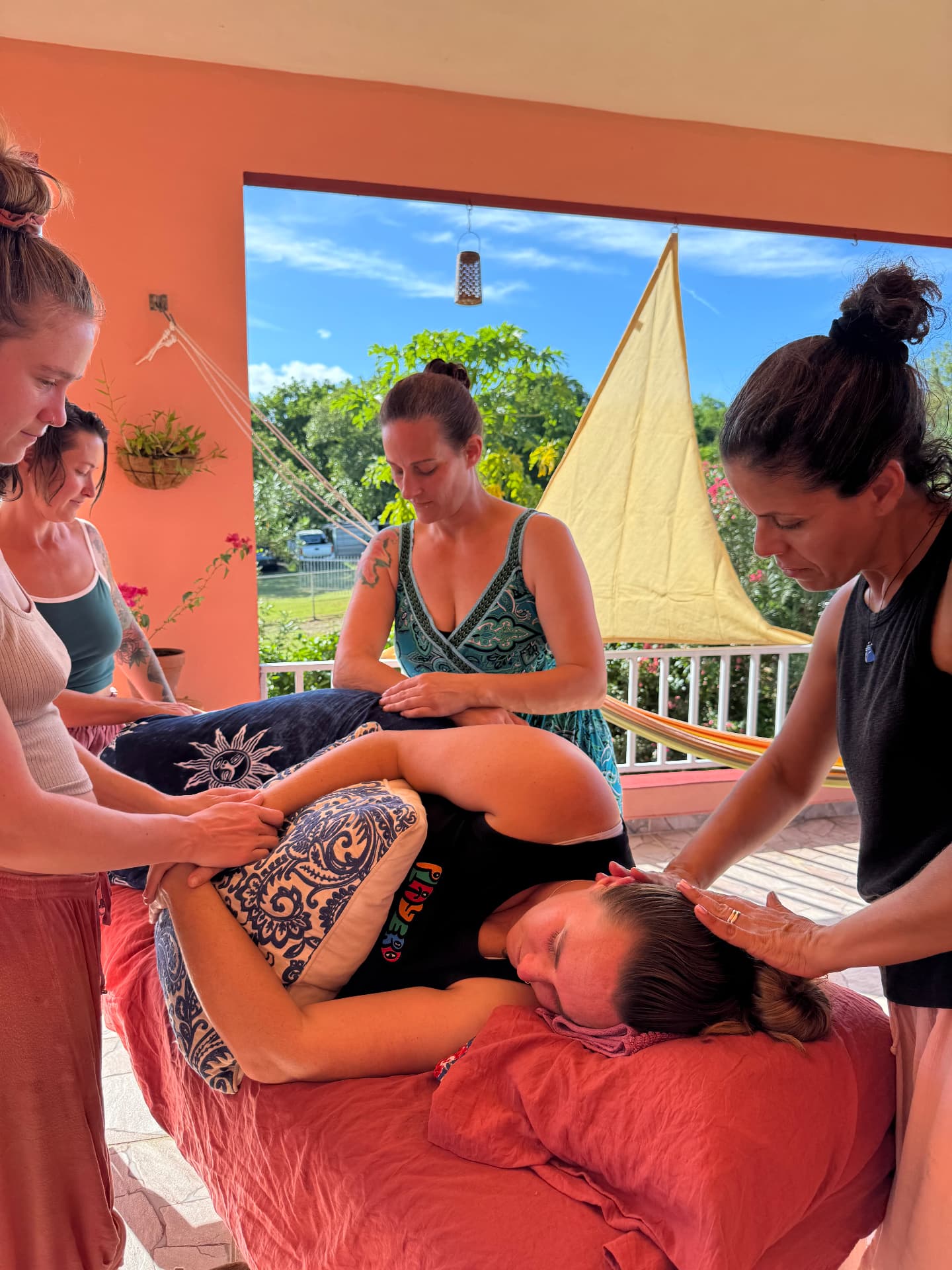 Students practicing bodywork together during a hands-on session