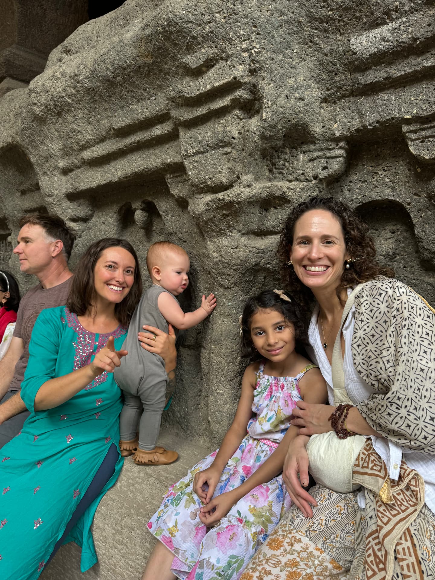 Group resting inside the carved rock caves