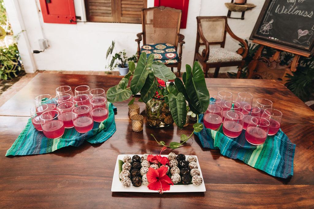 A welcome table set with herbal drinks and fruit for arriving guests