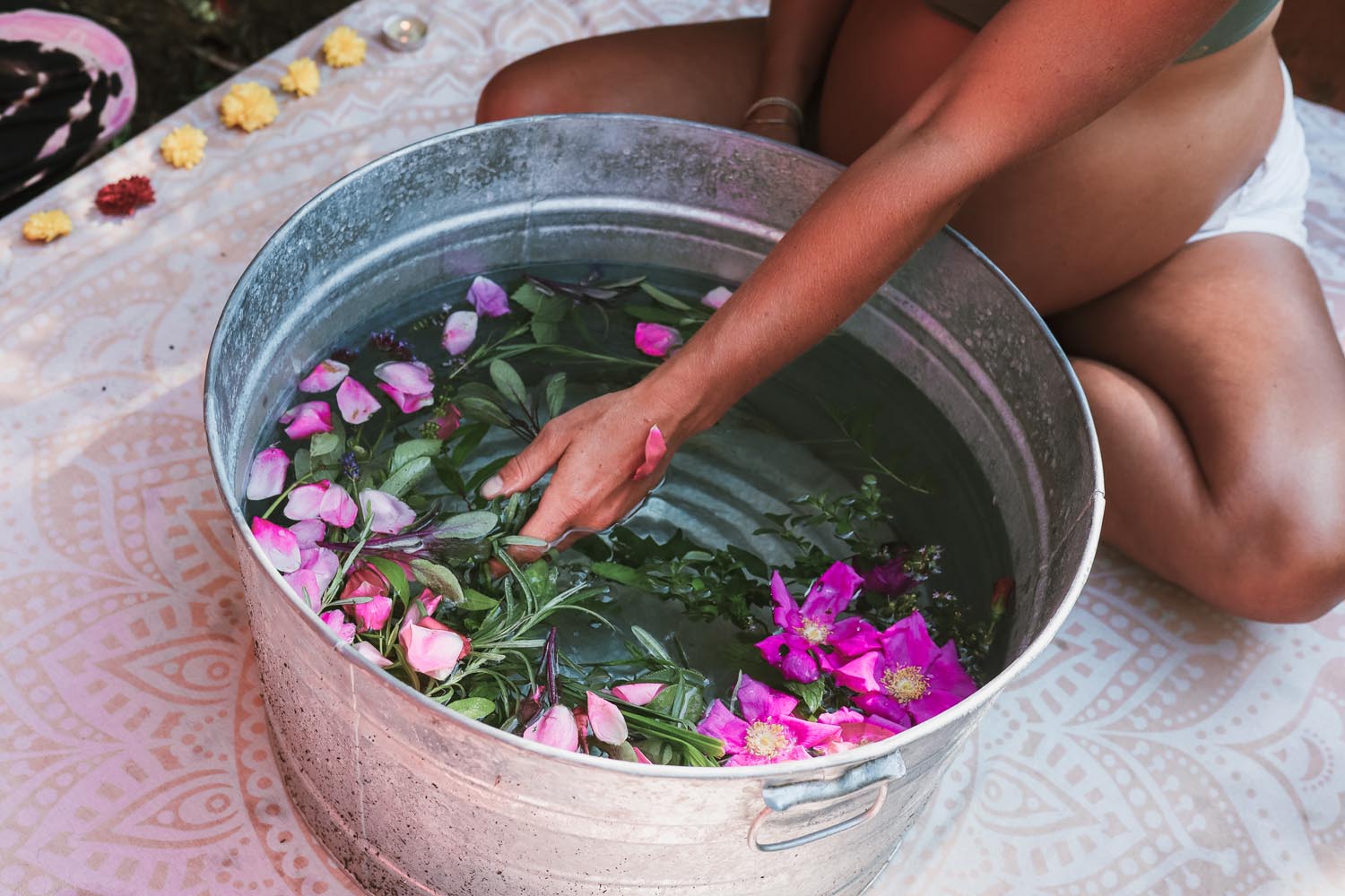 A rose petal herbal bath prepared for a guest