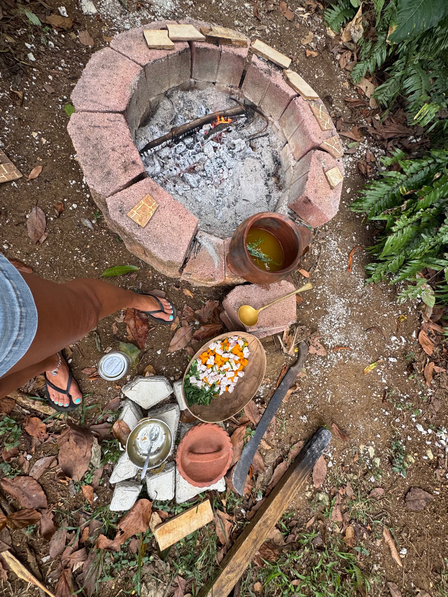 Preparing herbal decoctions over an open fire